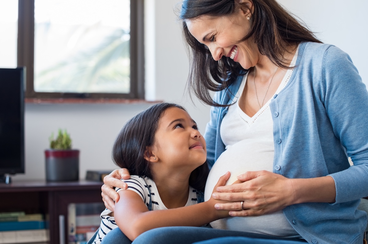 Pregnant woman with child
